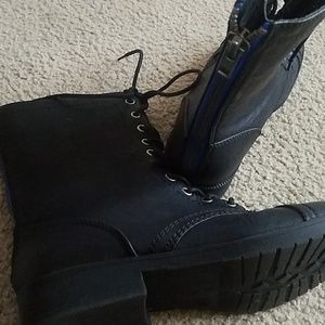 Lace up black boots with blue zipper accent